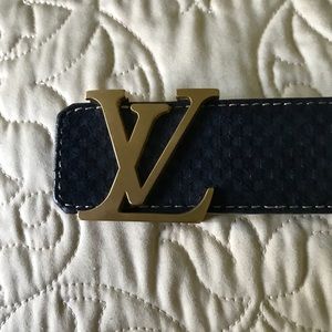 Luis Vuitton Belt, suede blue with gold buckle.